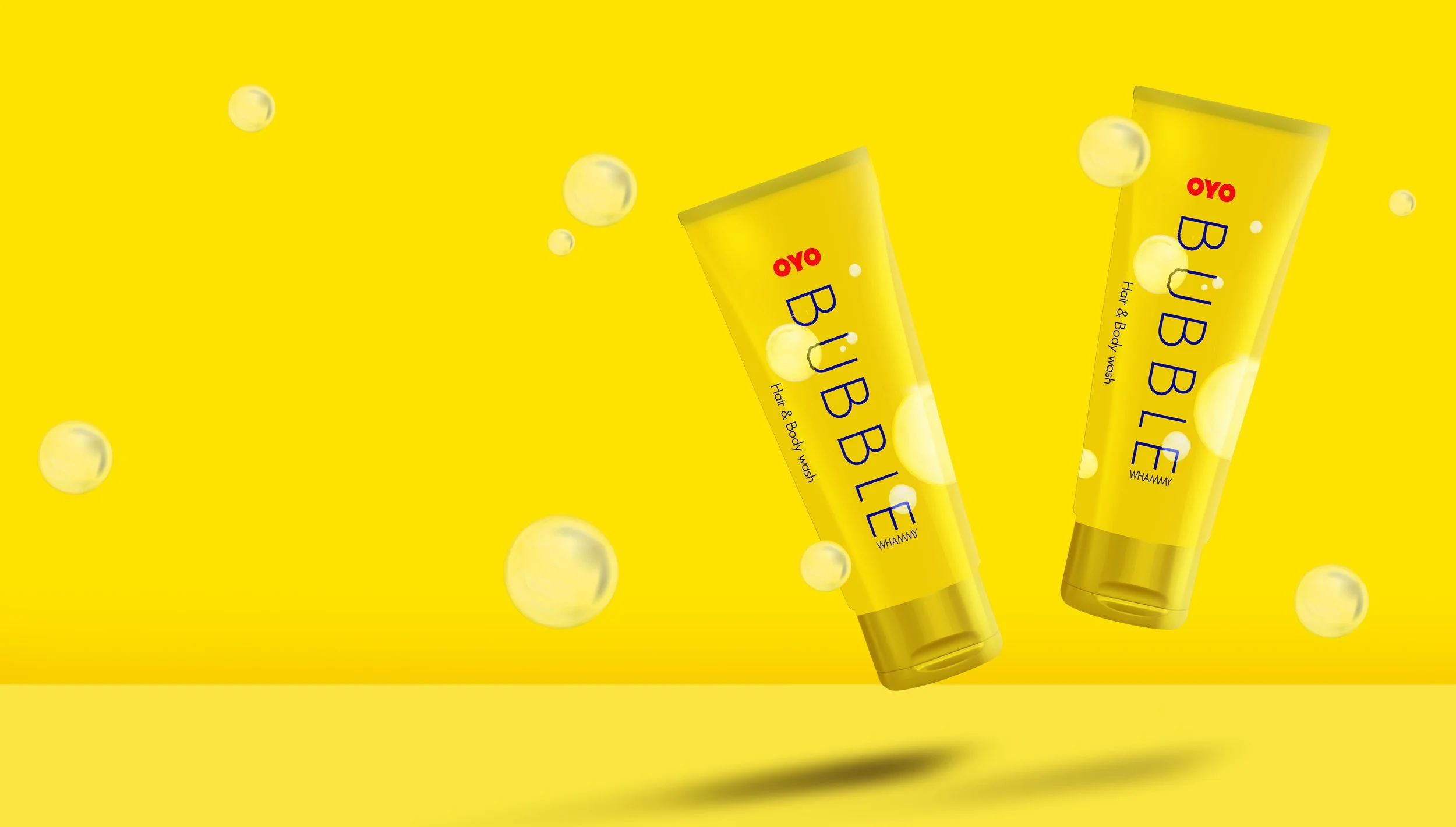 OYO Bubble Whammy — hair and body wash packaging in bright yellow with the OYO wordmark, part of the in-room amenity brand system